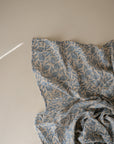 Lifestyle image of Organic Cotton Swaddle in Blue Flowers