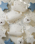 Mushie Snack Cup: white & blue star-shaped, spill-proof silicone cup for toddlers.