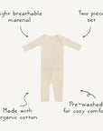 The mushie Two Piece Set is a cream-colored, long sleeve shirt and pants set for toddlers in ribbed fabric, featuring breathable organic cotton, pre-washed comfort, and a cozy design for baby clothing.