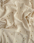 Lifestyle image of Organic Cotton Swaddle in Bees