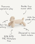 The mushie Lamb Figurine Teether, made from food-grade silicone in beige, encourages imaginative play, builds fine motor skills, soothes teething pain—reaching back molars—and is BPA/BPS/PVC/phthalate-free.