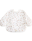 Mushie Long Sleeve Bib in a pink floral print with a front crumb pocket.