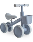 Light gray four-wheeled mushie Mini Toddler Bike with a front basket.
