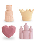 The mushie Princess Mold Free Bath Play Set includes four pastel, food-grade silicone toys—a princess bear, crown, faceted heart, and castle—arranged on a white background.