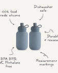 Two blue Silicone Puree Pouches by mushie are shown. Made from 100% food-grade silicone, they're BPA/BPS/PVC/phthalate free, dishwasher safe, durable, and reusable—perfect for mess-free feeding.