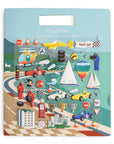 The mushie Reusable Sticker Set features colorful vehicles, puffy stickers of road signs, race cars, boats, a helicopter, trophies, and racing-themed accessories on a blue and green race track background.