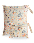 Two mushie Water Resistant Wet Bags in Space color, featuring a fun rocket and planet design with a beige strap. Includes one large and one small bag, perfect for organizing your diaper bag. Both are shown side by side on white.