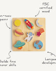 The Mushie Wooden Puzzle features colorful, space-themed pieces—sun, rocket, planets, astronaut, shooting star, UFO—on a square board. Made from FSC-certified wood with non-toxic paint; supports fine motor skills and language development.