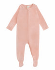 The mushie Zipper Pajama is a light pink, long-sleeved baby onesie with covered feet and a front zipper, ideal as cozy footed pajamas, shown on a white background.