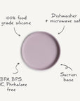 The Mushie Classic Silicone Suction Plate, in light purple, offers a secure suction base, is made from 100% food-grade silicone, dishwasher and microwave safe, and free from BPA, BPS, PVC, and phthalates—safe and non-toxic for toddlers.