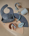 The mushie Silicone Toddler Starter Spoons are soft pastel baby feeding spoons with playful space-themed designs—ideal for encouraging independent feeding.