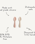 Two mushie Silicone Toddler Starter Spoons—one pink, one beige—are displayed on a white background. Made with food-grade silicone, they're BPA/BPS/PVC/phthalate free, dishwasher safe, and ideal for toddlers learning to self-feed.