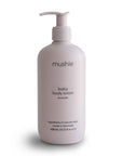 The mushie Lavender Baby Body Lotion comes in a white pump bottle, contains 400 ml (13.53 fl oz), features a calming lavender scent, is made in Denmark with natural ingredients.