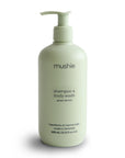 A 400ml light green pump bottle of mushie Green Lemon Baby Shampoo & Body Wash stands on a white background. Made in Denmark with ingredients of natural origin, this gentle formula is perfect for babies.