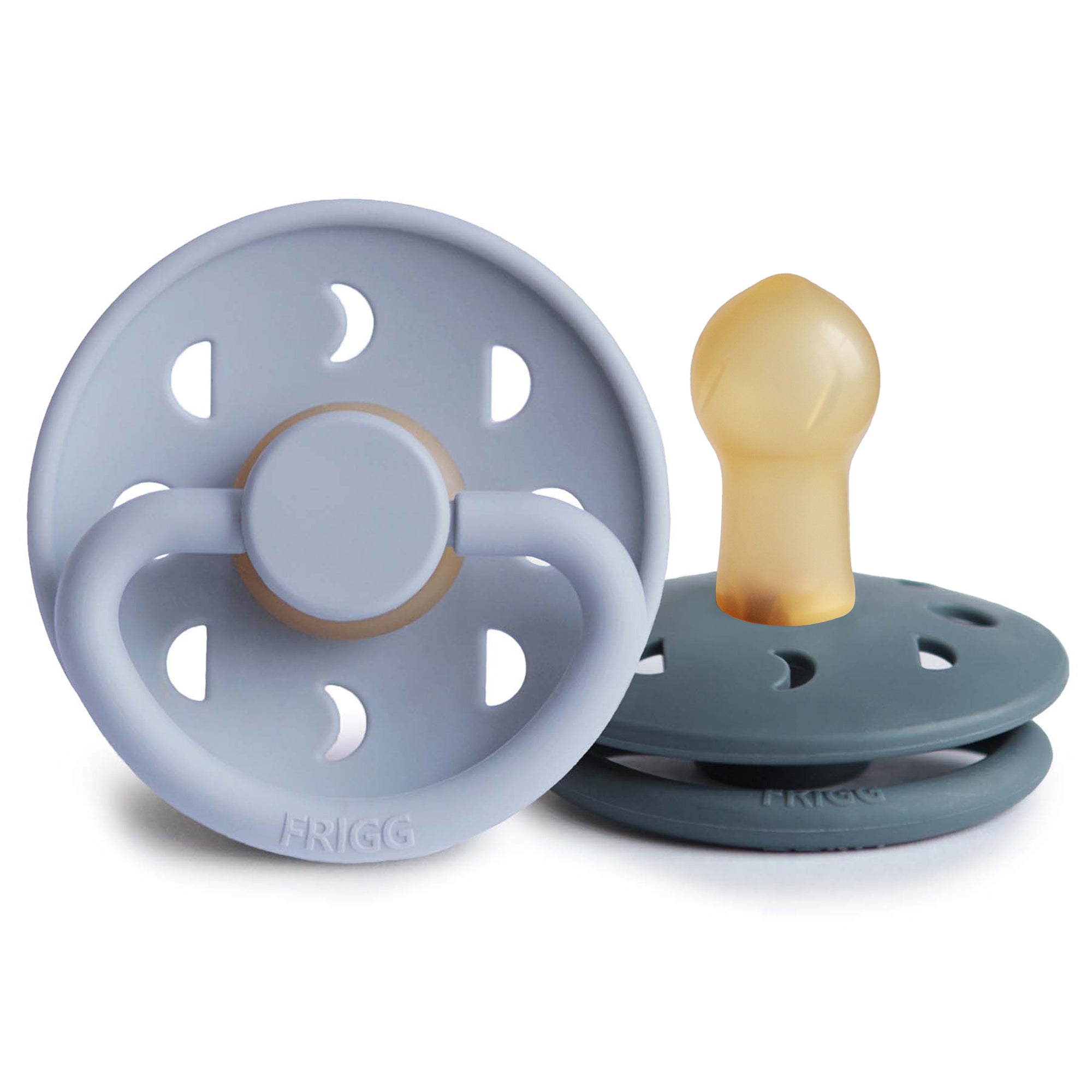 Two Frigg Moon Rubber baby pacifiers, one Powder Blue and one Slate, on a white background.