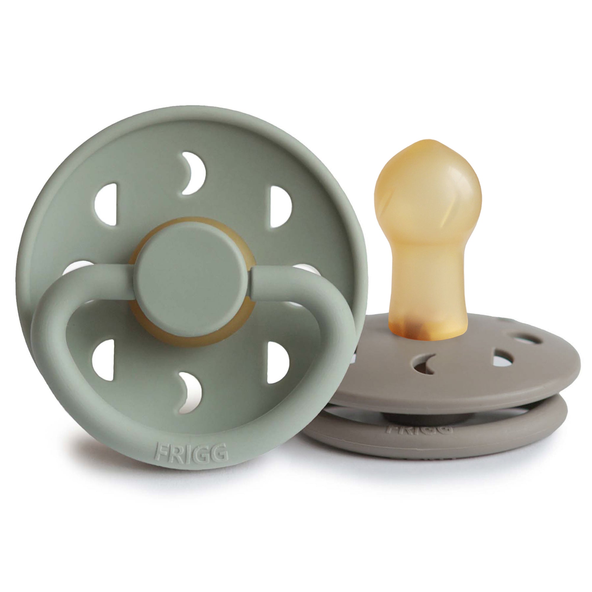 A product image of Frigg Moon Rubber pacifiers, one Sage and one Portobello, on a white background
