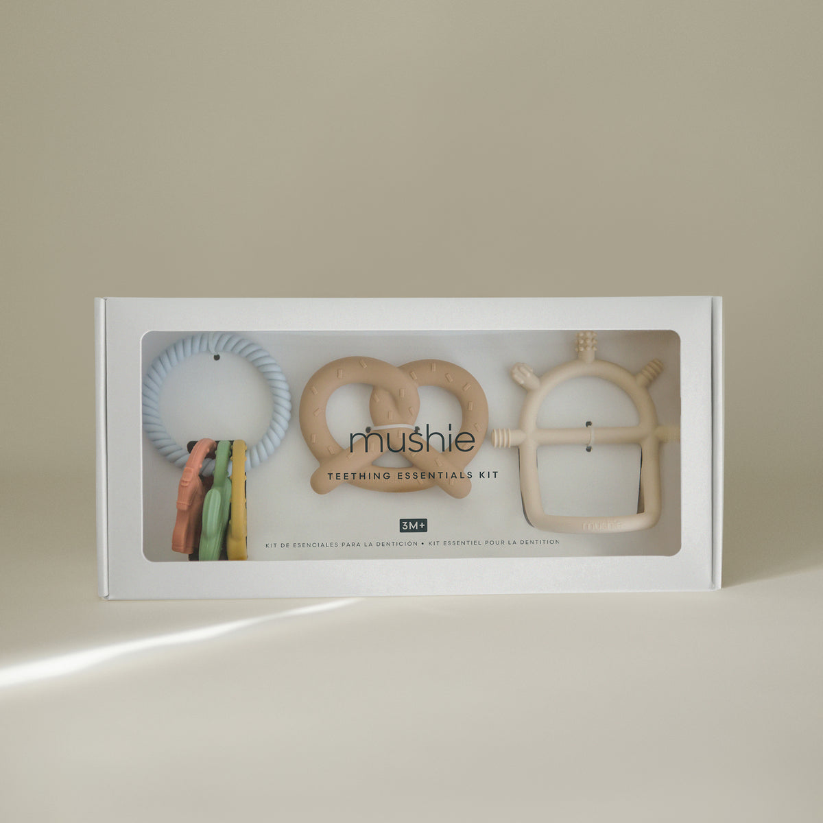 Mushie Teething Gift Set: 3 pastel silicone teethers in assorted shapes and colors, gift boxed.