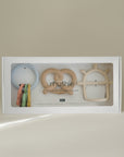 Mushie Teething Gift Set: 3 pastel silicone teethers in assorted shapes and colors, gift boxed.