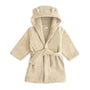 Wrap your toddler in cozy comfort after bath time with the mushie Bear Robe in Fog—a soft hooded robe with adorable bear ears, long sleeves, and a fabric belt at the waist.