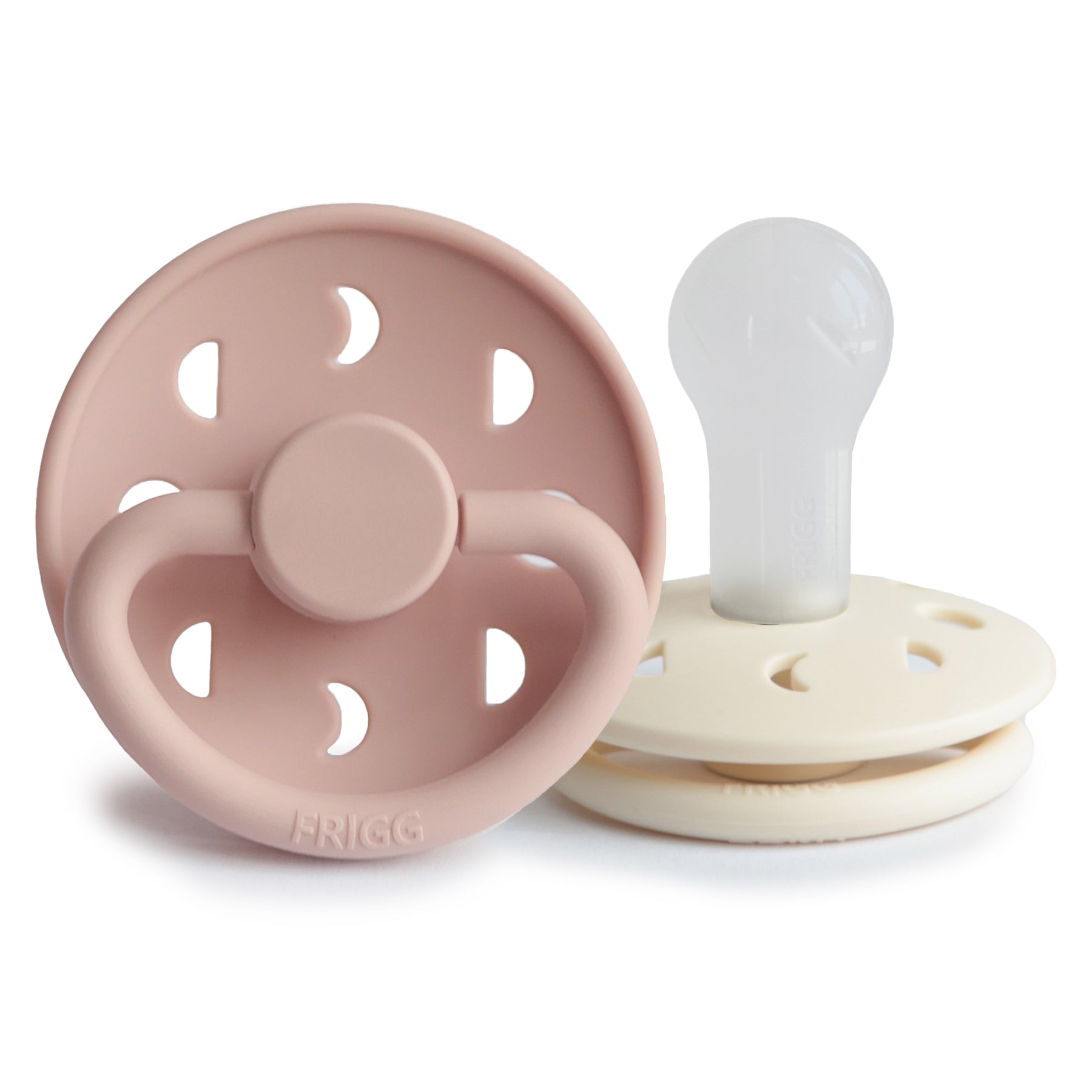 FRIGG Moon Silicone Pacifier 2-Pack in pink and white, upright on a white background.