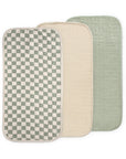Three Mushie Changing Pad Liners in Olive Check Combo—water repellent and rectangular.