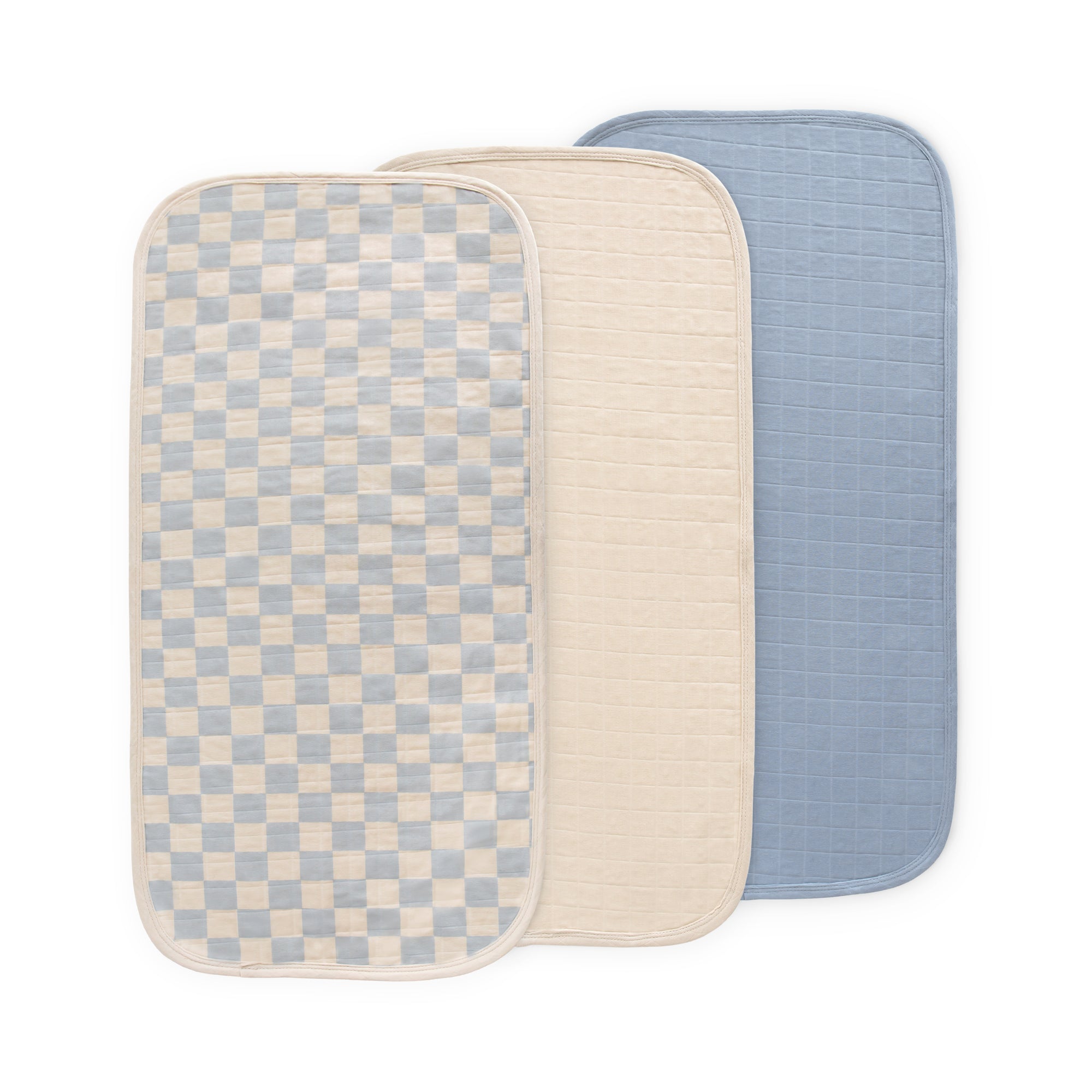 Mushie Changing Pad Liners: three overlapping—checkered, beige, and blue.