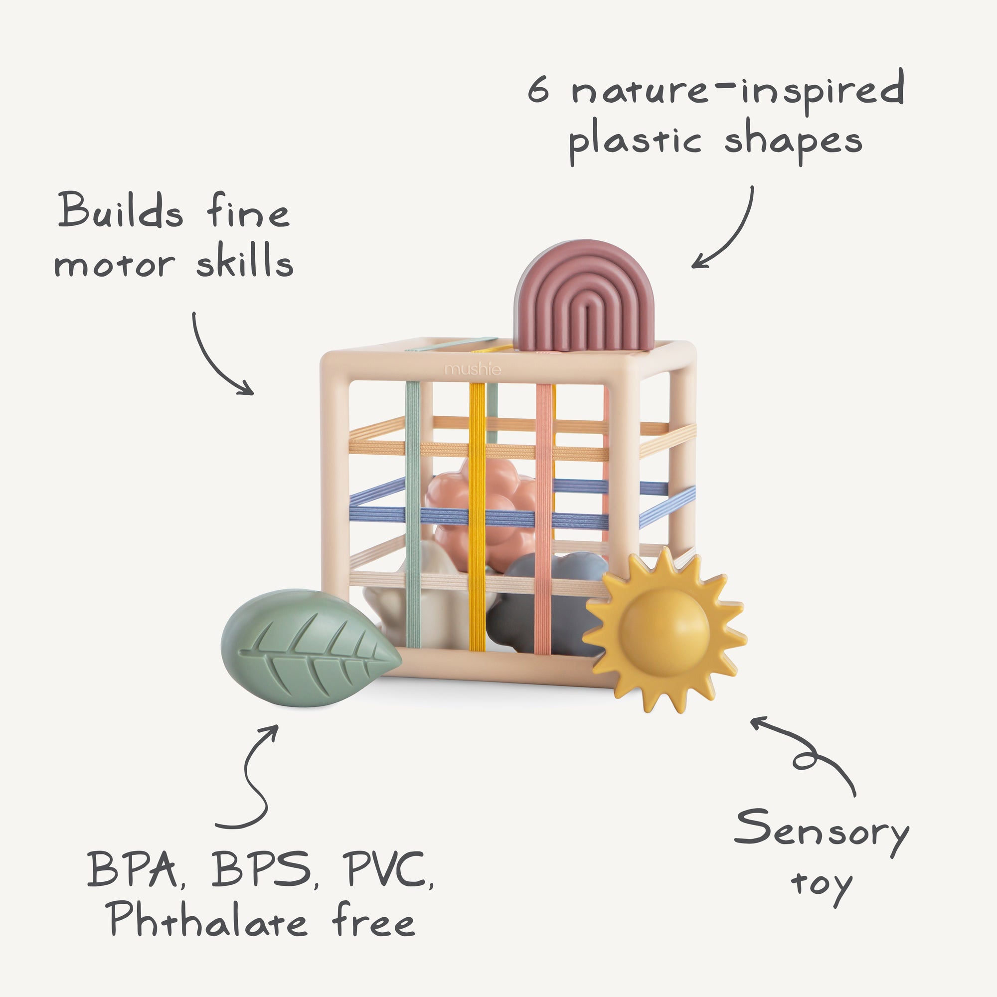 The mushie Elastic Shape Sorter is a cube sensory toy for tactile play and fine motor skills.