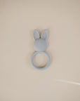 The mushie Bunny Teether is a gray silicone baby teether shown on a plain beige background.