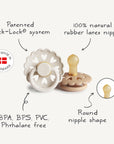 The FRIGG Andersen Fairytale Natural Rubber Pacifier 2-Pack by FRIGG features heart-shaped cutouts, patented Click-Lock system, round nipple, and is free from BPA, BPS, PVC & phthalates. Made in Denmark.
