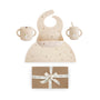 Mushie Hanukkah Doves Feeding Kit with a silicone bib, placemat, and cups above a gift box.