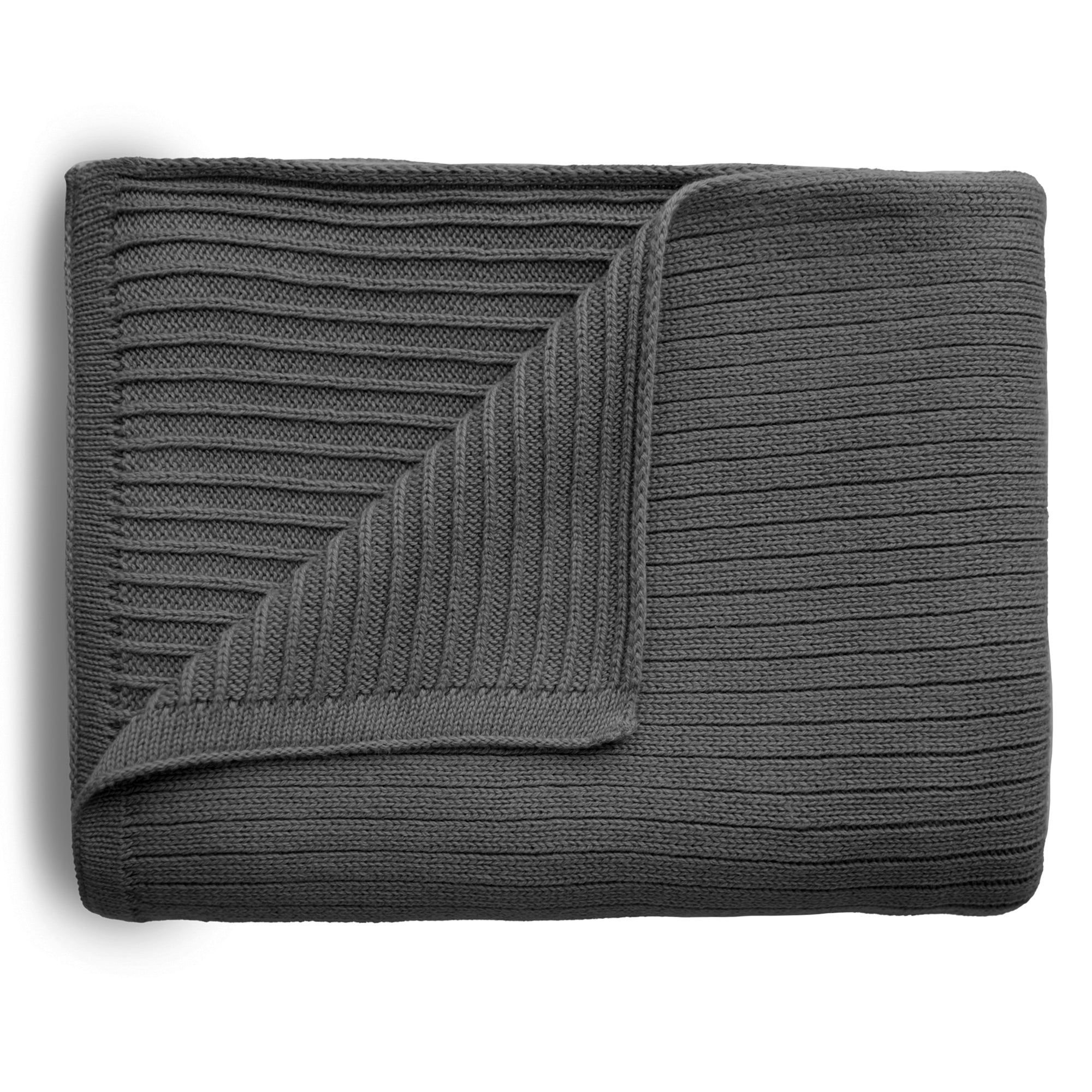 The mushie Knitted Ribbed Baby Blanket in dark gray is neatly folded with a corner turned over, showing its textured ribbed design on both sides against a white background.