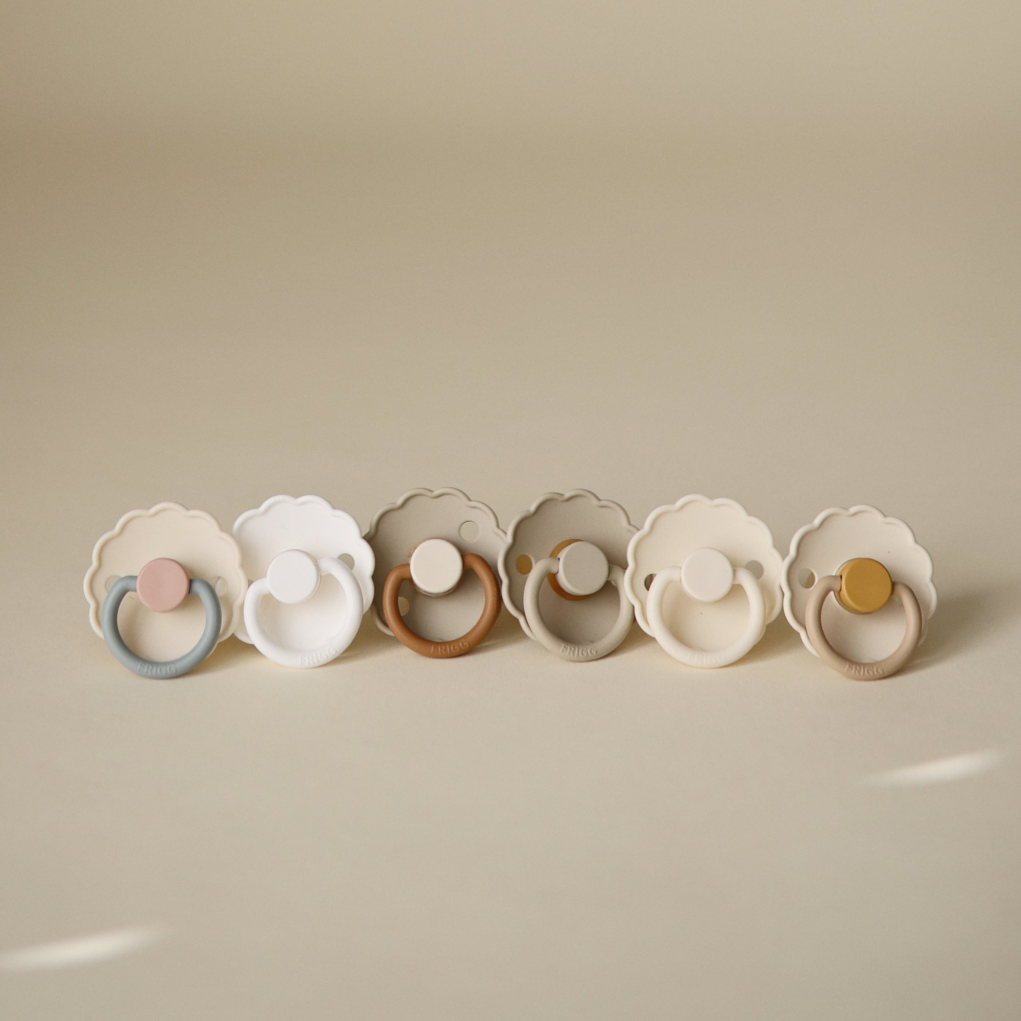 FRIGG Daisy Natural Rubber Pacifier 2-Pack, pastel colors, scalloped edges, latex nipple.