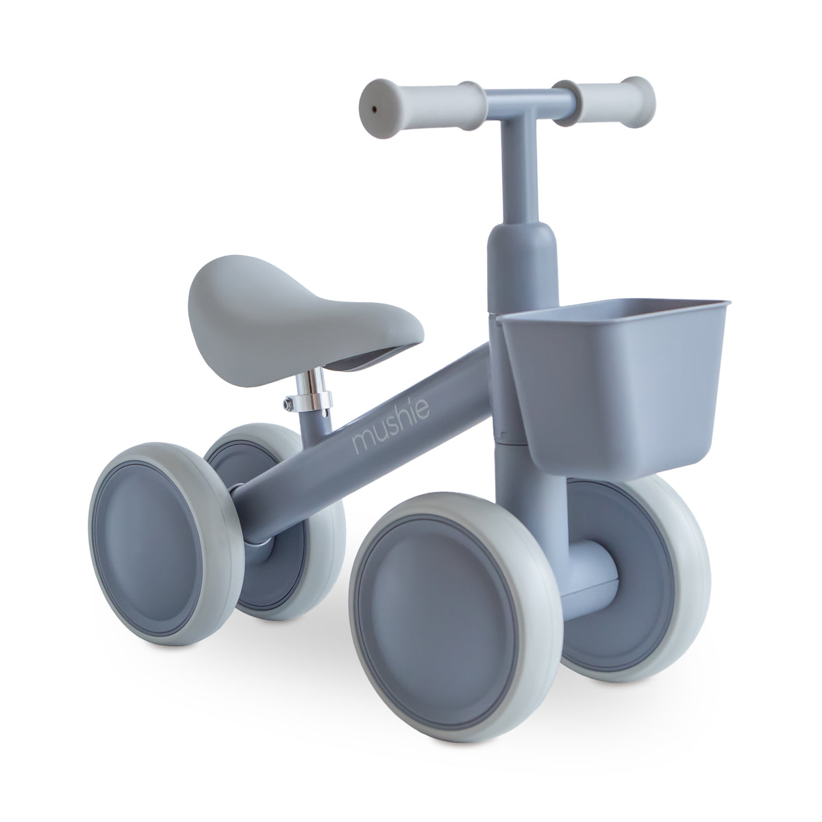 Light gray four-wheeled mushie Mini Toddler Bike with a front basket.