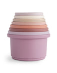 Mushie Stacking Cups Toy: 7 pastel cups for stacking, largest cup at the base.