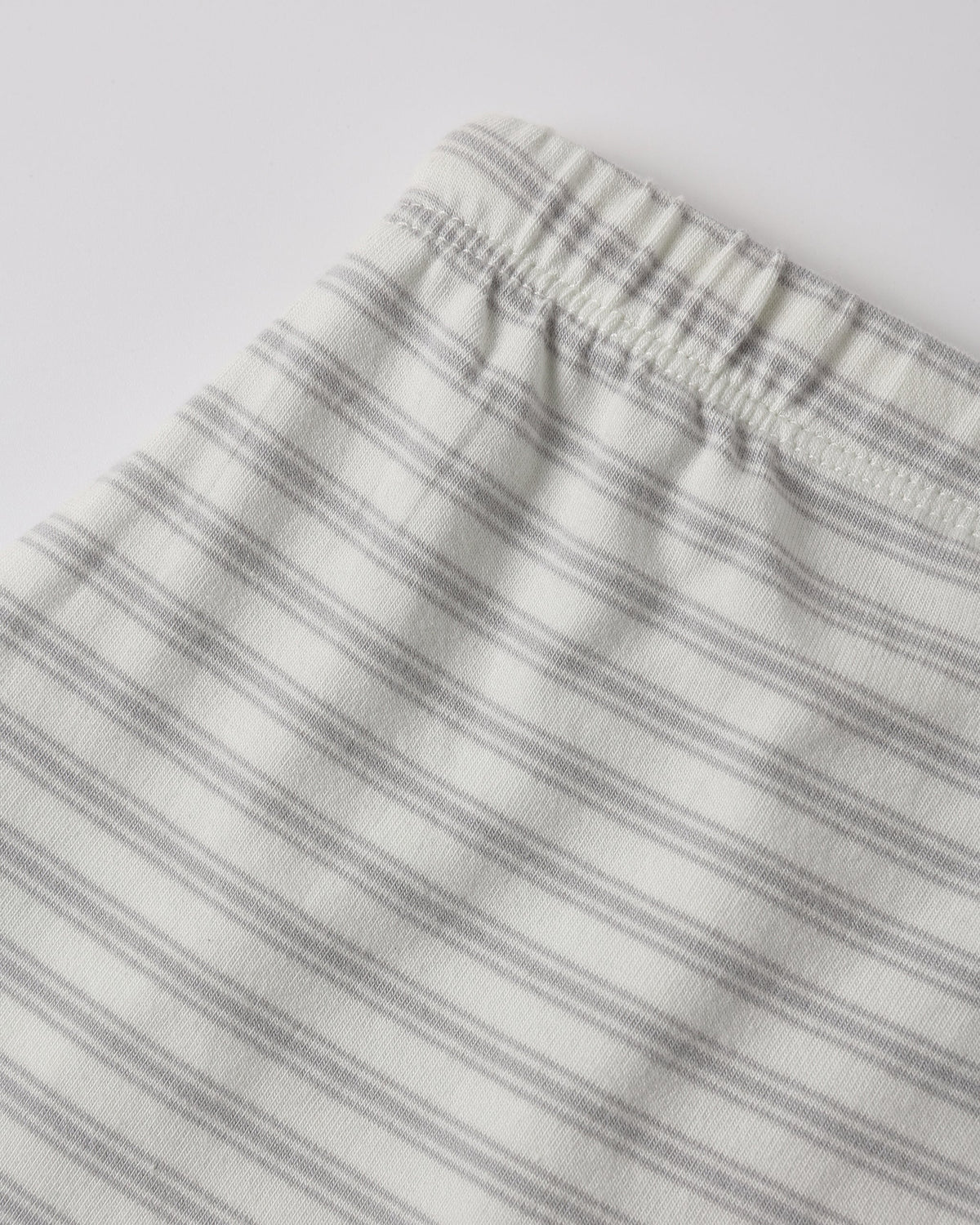 Close-up of Rylee + Cru Drawstring Pant Cloud Stripe with gray and white elastic waistband.