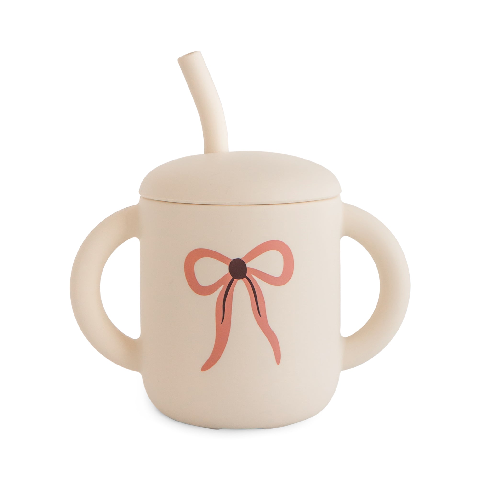 Mushie Silicone Training Cup + Straw—beige, two handles, pink bow; perfect for toddlers.