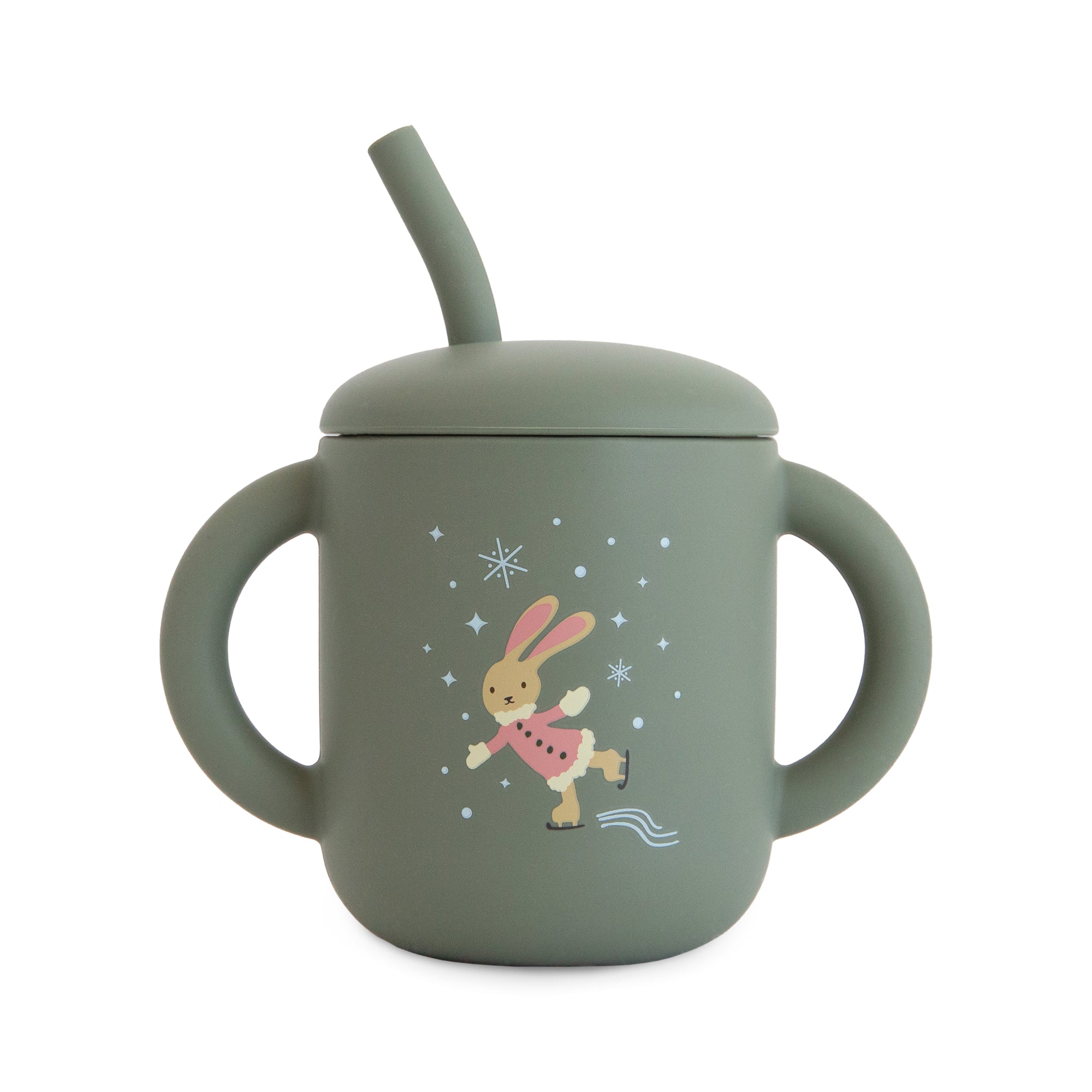 Mushie Silicone Training Cup + Straw, green with handles and skating bunny on front.