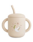 Mushie Silicone Training Cup + Straw in cream with handles, dove, olive branch, and stars.