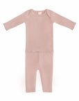 Mushie Two Piece Set: light pink organic cotton baby shirt & pants, laid flat on white.