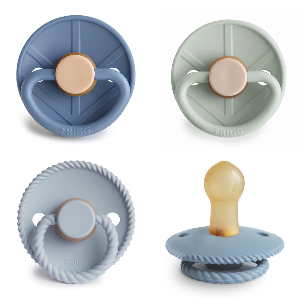 FRIGG Natural Rubber Pacifier 4-Pack in blue, green, and light gray with varied textures.