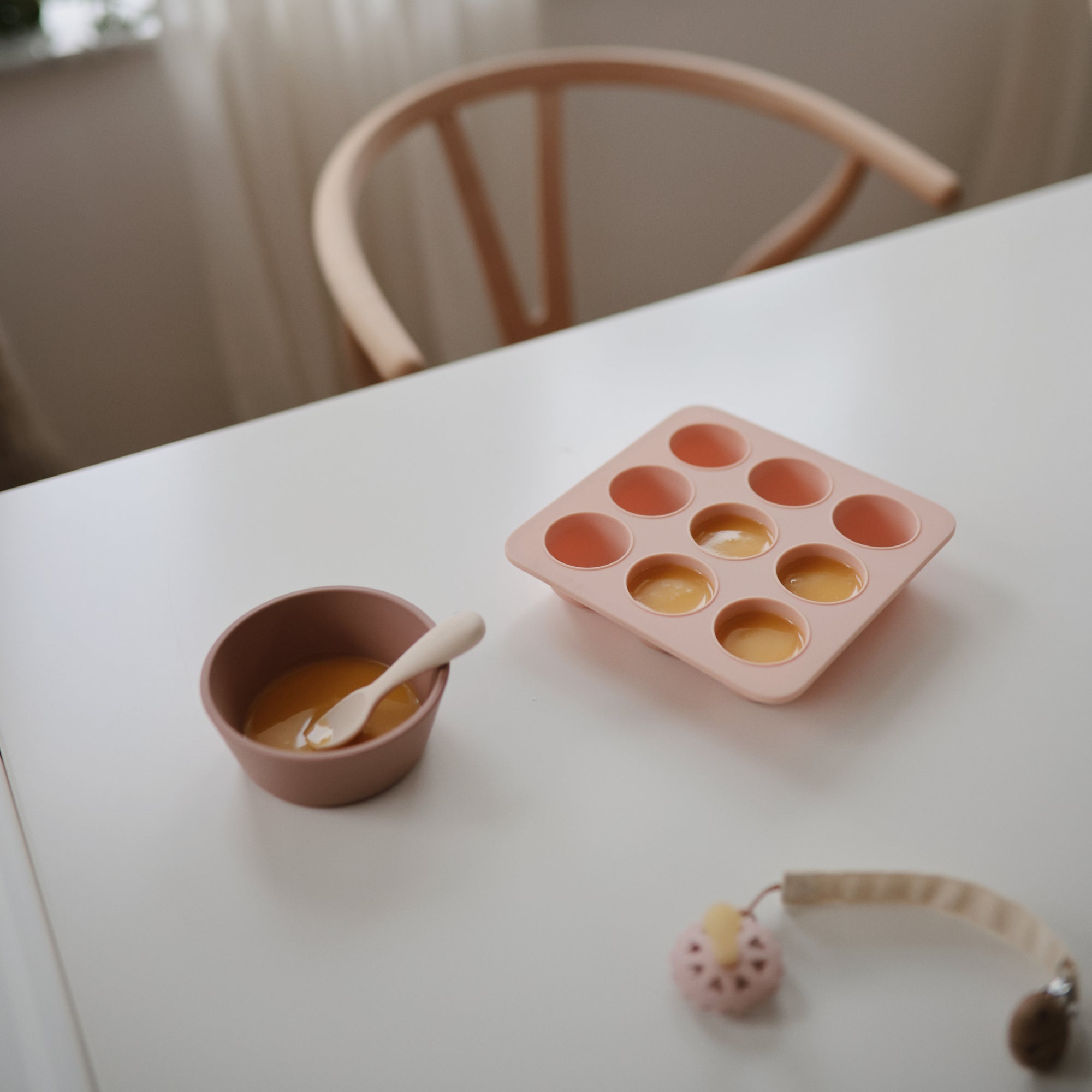 Mushie Baby Food Freezer Tray in pink, BPA-free silicone, perfect for baby food storage.