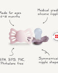The FRIGG Lucky Symmetrical Silicone Pacifier 2-Pack (6-18 Months) features BPA/BPS/PVC/phthalate-free, medical-grade silicone nipples for healthy oral development. Made in Denmark by FRIGG, these pink and purple pacifiers are shaped symmetrically.