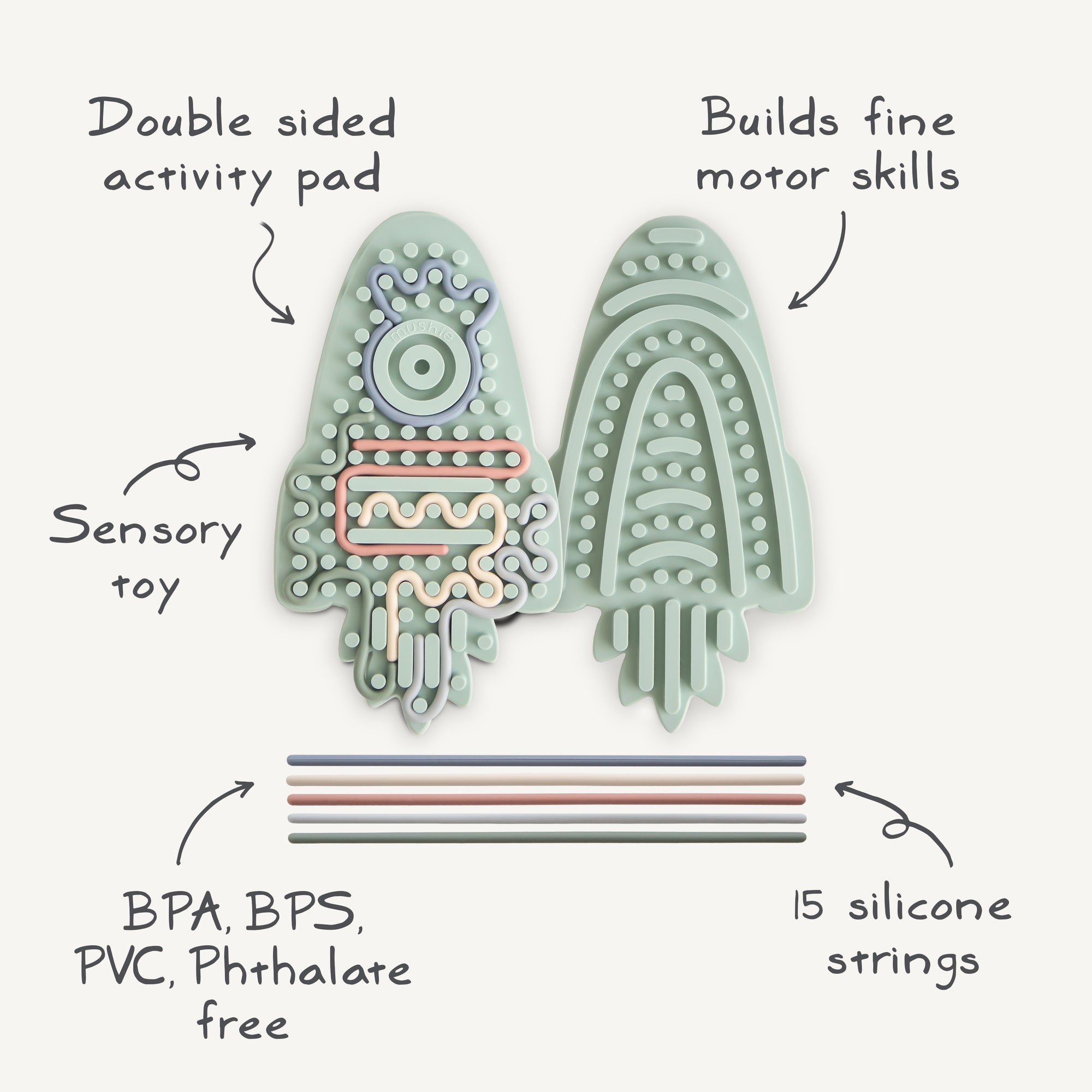 Mushie Silicone Sensory Toy: rocket shape with fine motor labels and colorful strings below.