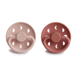 Front view of Blush and Powder Blush Moon Silicone Frigg pacifiers. 