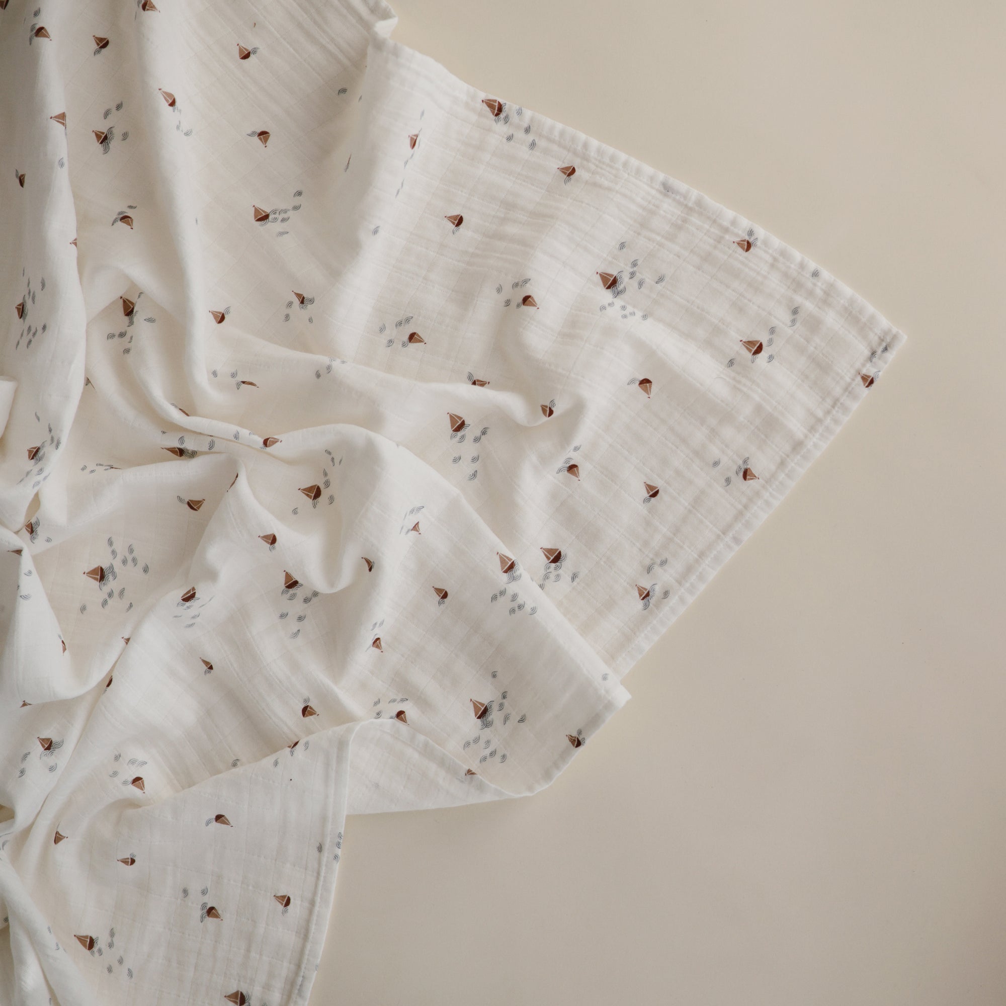 Lifestyle image of Organic Cotton Swaddle in Boats